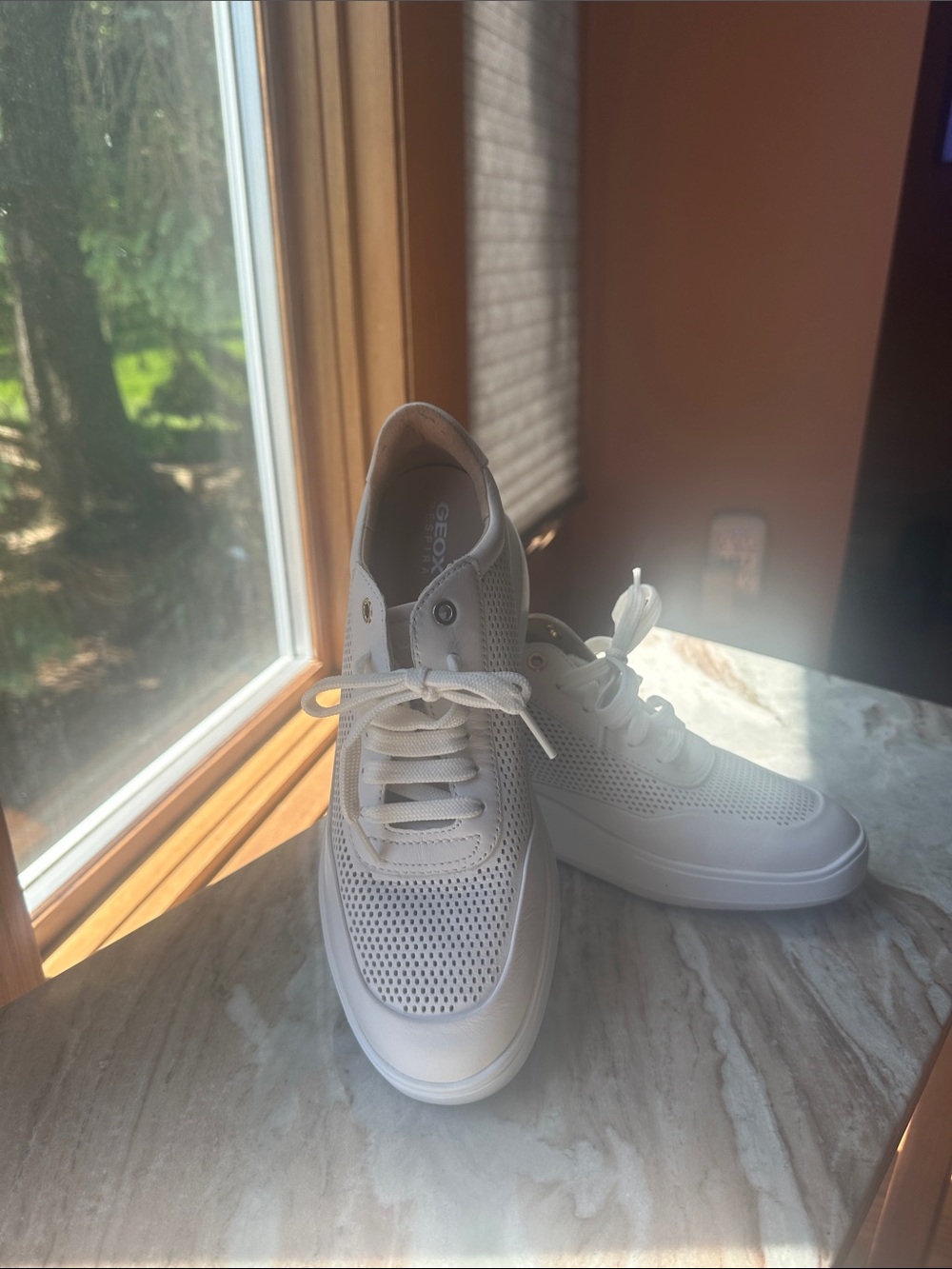 Geox Rubidia women’s white leather sneakers.